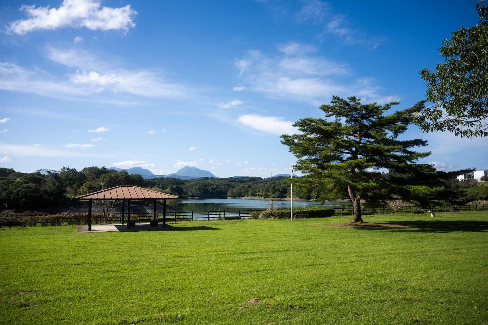 a gazebo in the middle of a grassy field